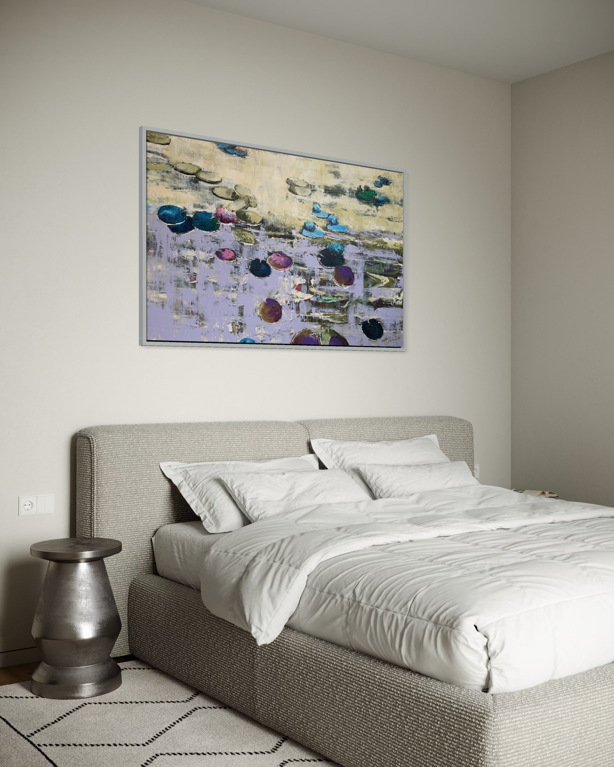 Peaceful Japandi style bedroom interior featuring a massive horizontal original painting by two sisters from Ukraine. The serene water lilies canvas in a silver frame hangs on a neutral plaster wall above a cozy grey textured upholstered bed.