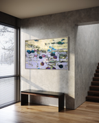 Oversized horizontal water lilies canvas painting in a silver frame hanging on a textured grey plaster wall. Below the artwork is a minimalist dark wood bench, styled in a luxury modern entryway with a contemporary wooden staircase and soft natural light.