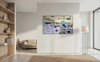 A grand, oversized horizontal fine art painting from Hutsul Art Gallery displayed on a central wall in a luxury minimalist home. The framed water lilies canvas stands out in a vast, open-space interior with light wooden floors, a designer shelf, and a floor lamp.